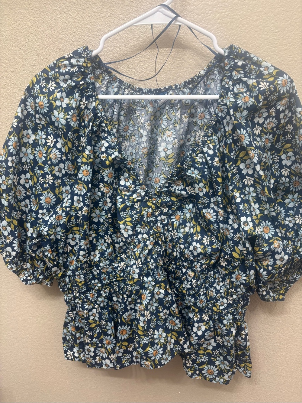 Smocked V-Neck Peplum Top